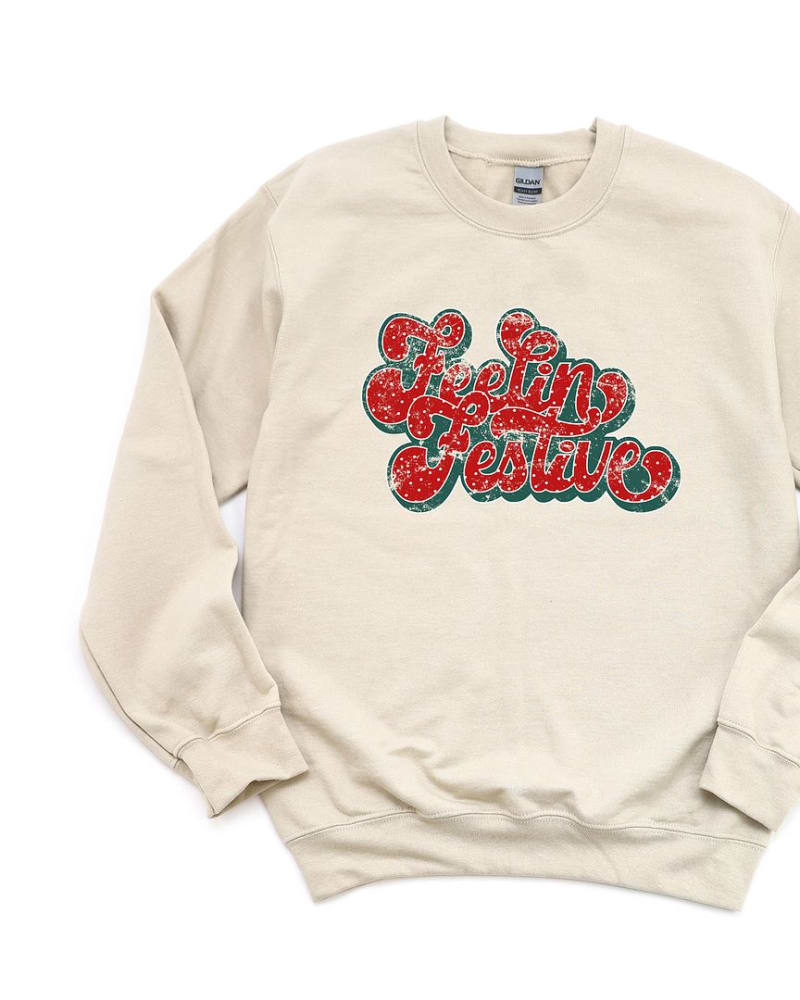 Front of a size L Distressed Feelin Festive Graphic Sweatshirt in Dust by Simply Sage Market. | dia_product_style_image_id:315507